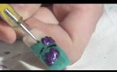 Purple Glitter Bat Nail Design
