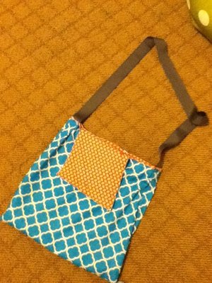 This is a bag I sewed yesterday In about three hours for my new gym bag. It has a snap clasp and a fold over flap closure. 