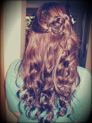 Curled hair using the wand then pinned a half pony to the side, twisted curls up and pinned in place.