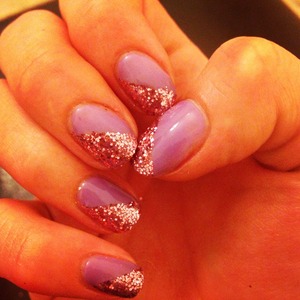 Lilac Longing shellac with rose pedals glitter 

Lasted 3 weeks! 