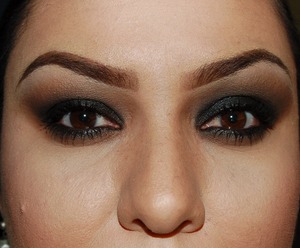 Primer for eyes and face: Hard Candy

Eyelid:  Applied black crayon (NYX jumbo) and blended out up towards crease and outer 
             browbone.  Then packed black shimmery eye shadow on lid only. (ULTA eyeshadow in 
              GALAXY)

Crease: Applied brown shadow (NYX nude matte eyeshadow in TRYST) and blended to
               eliminate harsh lines from lid .

Browbone: applied a littlemore brown shadow  and blended out and up from the crease into 
                     browbone in circular motion

Highlight:  ULTA eyeshadow in BONE

Eyebrows: Anastasia eyebrow duo in BRUNETTE

Lips: Revlon super lustrous lipstick 001 NUDE ATTITUDE and Victoria's Secret Beauty Rush in 
          HONEY DO on top. Lip Liner: L'oreal Color Riche  in BELLE NATURELLE  mechanical 
          pencil.

Foundation and powder: L'oreal Perfect Match both in W4

Contouring and Highlighting: BH cosmetics Contour and Blush 6 color palette

Eyelashes: Maybelline Volume'Express Falsies waterproof Mascara

Blush: Cover Girl Cheekers in PRETTY PEACH
