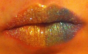 Nice shiny lipgloss covered rainbow glitter lips. 