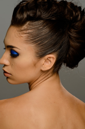 Cage braid created with tease inside. 
Clean contour make up with bright blue eyeshadow