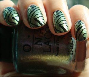 OPI Not Like the Movies with zebra nail stamping from Konad Image Plate m57
More photos here: http://www.swatchandlearn.com/opi-not-like-the-movies-swatches-review-konadicure/