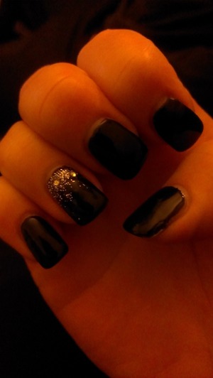 nail black shellac with glitter and gem feature