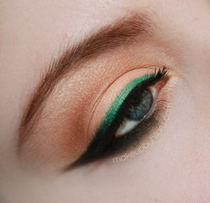 A neutral eye with emerald liner.