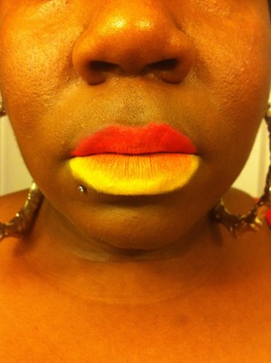 A bright summer fun look: Orange top lip, golden yellow bottom lip, with a lighter orange in the middle of lips