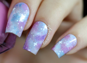 More info + a tutorial here:
http://www.lacquerstyle.com/2013/11/holographic-pastel-galaxy-nails.html