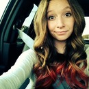 Curled hair with red tips