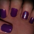 Purple nails with glittery accent nail