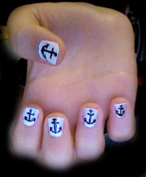 Black anchors over white nail polish