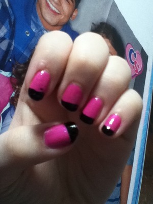 Pink and black nails. 1) paint your nails pink 2) put tap over them after there dry 3) paint black at the tips and there you go your done :)