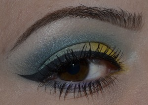 For this makeup I used a yellow eyeshadow in the inner corner of the eye then I blended it with a light-green eye  shadow (sephora) in the middle part of the mobile lid. In the outer corner i use a darker green eyeshadow (sephora). In the crease i use a light-blue matte eyeshadow from sephora and i blended it with another shadows from sephora (dark blue), an eyeshadow from kiko (teal) and a black eyeshadow from the naked palette (the black eyeshadow one). In the under part of the eye i put also the yellow chrome eyeshadow from mac, a violet eyeshadow from kiko in the middle part and the teal eyeshadow from kiko I used before. As eyelighter I used 2 eyeshadow from the naked2 palette, under the eyebrow I used the foxy eyeshadow (and some concealer) and in the inner corner of the eye bootycall eyeshadow. Then I used a dark matte eyeliner from kiko cosmetics (called precision eyeliner) and they're real mascara from benefit (I LOVE IT!). For the eyebrows I used the automatic eyebrow pencil from MAC in spiked.