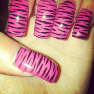 Used fake nails , painted it hot pink and stamp it with a zebra print.