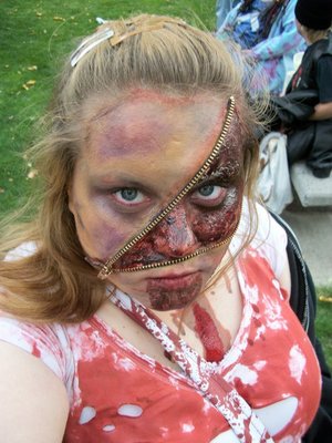 This is a photo of me during the 2010 Zombie Walk of Billings, MT. All I used was a zipper you get from a fabric store, or walmart, I cut the fabric part off of it, I then used bh cosmetic's pallets to create the bruises and then doused myself in fake blood! The bloody part of the zipper was some gel type stuff I got at Spirit Halloween and then I just added red pigment on top of it! 