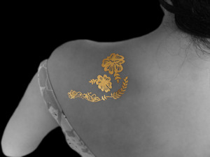 We are creators of wonderful designs which are then converted in to 24K Certified Gold Henna (Temporary Body Art). You may self apply them as it is very easy to do so or get help from one of our nominated beauty spas to create an Artistic Collage by use of multiple designs. 

Be it a special occasion like wedding or an engagement or just a fun night out with friends; our 24K Gold Body Art is sure to Enhance Your Beauty.