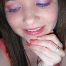 peach and purple + purple lashes. and french tip nails.