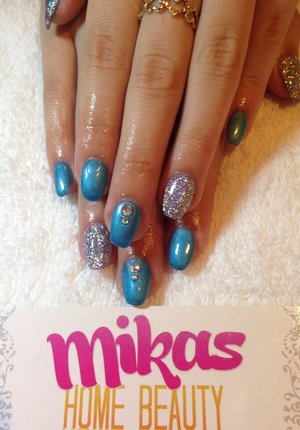 Did these beauties myself! All acrylic with blue Gel polish and rhinestones! X