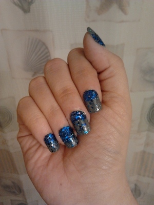 I kept it simple and painted each nail with Julep Meryl. I applied Sally Hanson’s Clear to the bottom half of the nail. I then dipped each nail into blue glitter I bought in a package at the dollar store. I finished with a clear top coat!