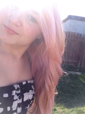 Applied extremely diluted cotton candy pink all over, it's lilac in some places from where the purple hadn't faded all the way, and super light pink in places that were very blonde. I love it. :) 