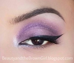 Simple purple eyeshadow with winged black liner