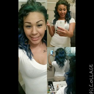 Mermaid like hair. blue liner on lower lid. green blue and brown eyeshadow. black liner on upper lid. ebony brows. 