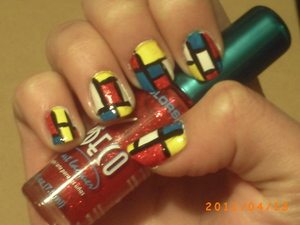This was one of my first nail art designs. It isn't very clean but it was when I figured out how much I love nail art. So I leave it up to show people how far I've come.

I did this for art class, it was inspired by Piet Mondriann's painting Composition A.

For this design I used:

Sally Hansen Xtreme Wear- White On (base)
L.A. Colours Art Deco- Red Glitter (patch)
L.A. Colours Art Deco- Yellow (patch)
L.A. Colours Art Deco- Black (outline)
Icing Nail Art- Blue (patch)