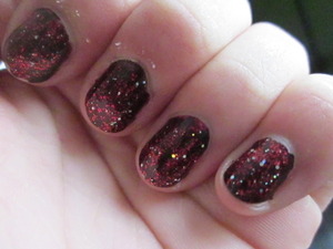 Black nail polish for Nicole and Red-and-other glitter nail polish , kinda look like stars. Simple !