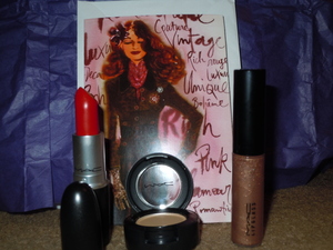 Prizes I received from a subscriber contest on Youtube. Ruby Woo lipstick,Ricepaper eyeshadow and Lipglass in Oh baby