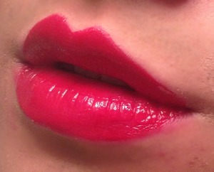 Simple red lip with sheer gloss on top.