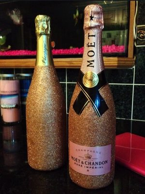 Glitter champagne bottles I decorated for my brothers wedding :-)
