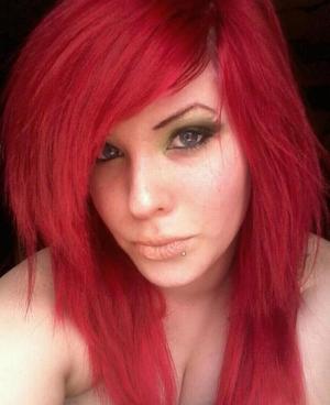red hair. green smoky eye. neutral lips.