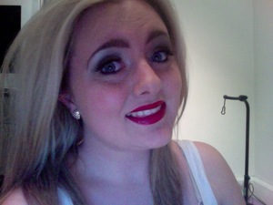 Smokey eyes with a cherry red lip...perfect for christmas