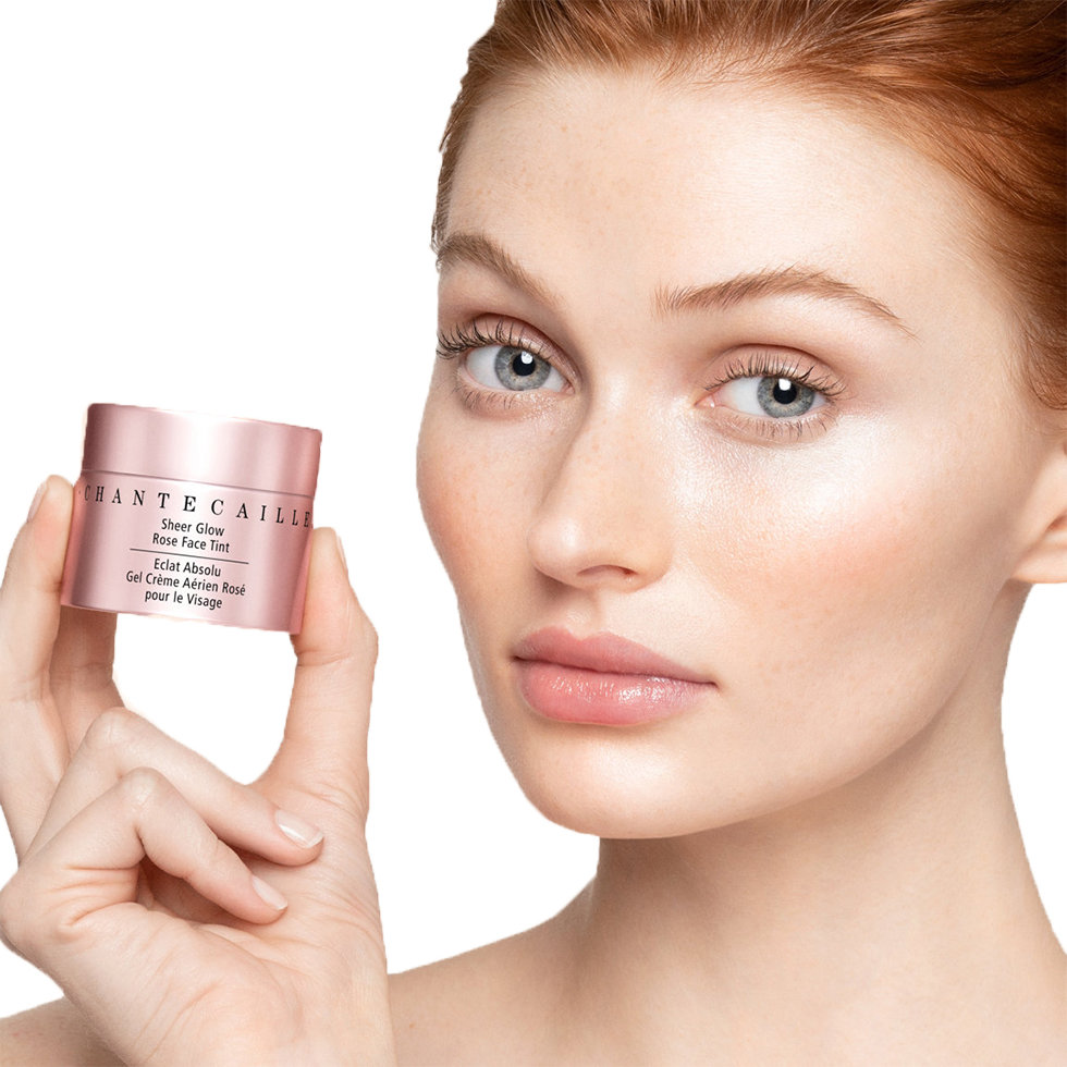 Chantecaille model holding the Sheer Glow Rose Face Tint