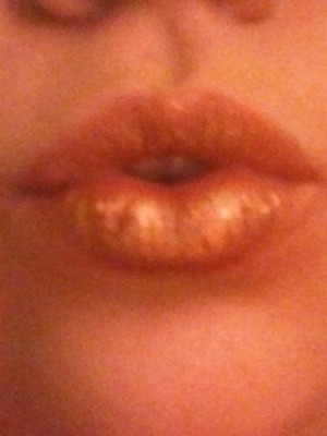 gold and dark red lips
