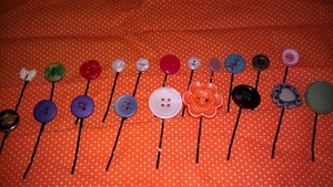 So since a lot of my girl friends' birthdays are coming up this summer I tried out a new idea of attaching cute buttons to bobby pins for something cute to accessorize with. Super easy and can be done on the cheap!