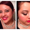 Winged eyeliner, bright coral lips