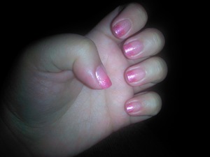 this is a pink french tip nail with some glitter