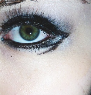 I combined silver eyeshadow, false lashes and a black liquid liner to get this look.