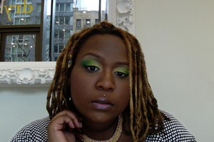 Yellow to green shadow blended with light pink shimmery gloss.