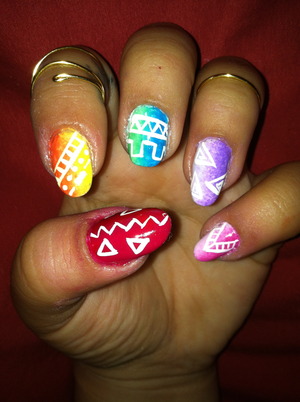 Rainbow ombre nails with tribal print designz.