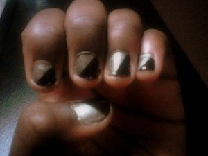 I painted my nails with the silver polish and then painted a diagonal line across my nail with the  black polish. You can use tape to block where you don't want the nail polish to be if you can't do this design free hand. 