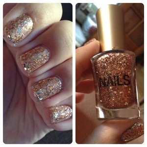 I used a Maybelline Colorama nail polish in 254 as a base and then added about 2-3 coats of a glitter polish by Nails.