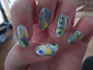 water marbling + nail art + gems. before I finished cleaning up!