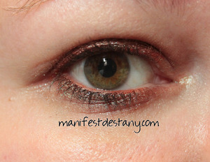 FEVERShadow by Wishful Bath & Beauty in Play in the Waves on the lid and lower lashline, while the upper lashline and waterline are lined with an orange Sephora eye liner