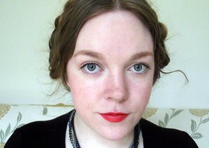 Rocking natural eyes and an orange-red lip. In real life this lipstick is really quite orange. Plaits pinned up on my head.