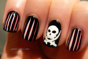 I did these for a "flag" theme. So these are pirate flag nails!

Blog post: http://www.polishrainbow.com/2012/12/take-two-day-2-flag-nails.html