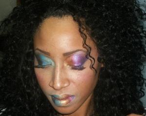 I was in the shop bored on a slow day so i decided to play around with my make-up & this is what i came up with. LOL just having fun.  This is also a full weave I am wearing that i did on myself, even the front it is a new technique that i used.