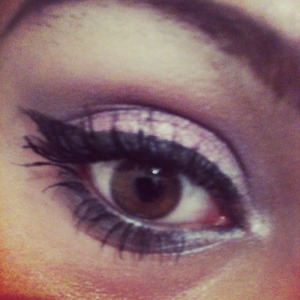 Metallic pinks and purples with a bold winged liner and heaps of mascara. 