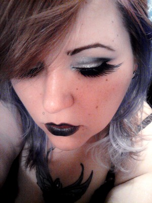 Silver and Black smoky eye with black winged lashes